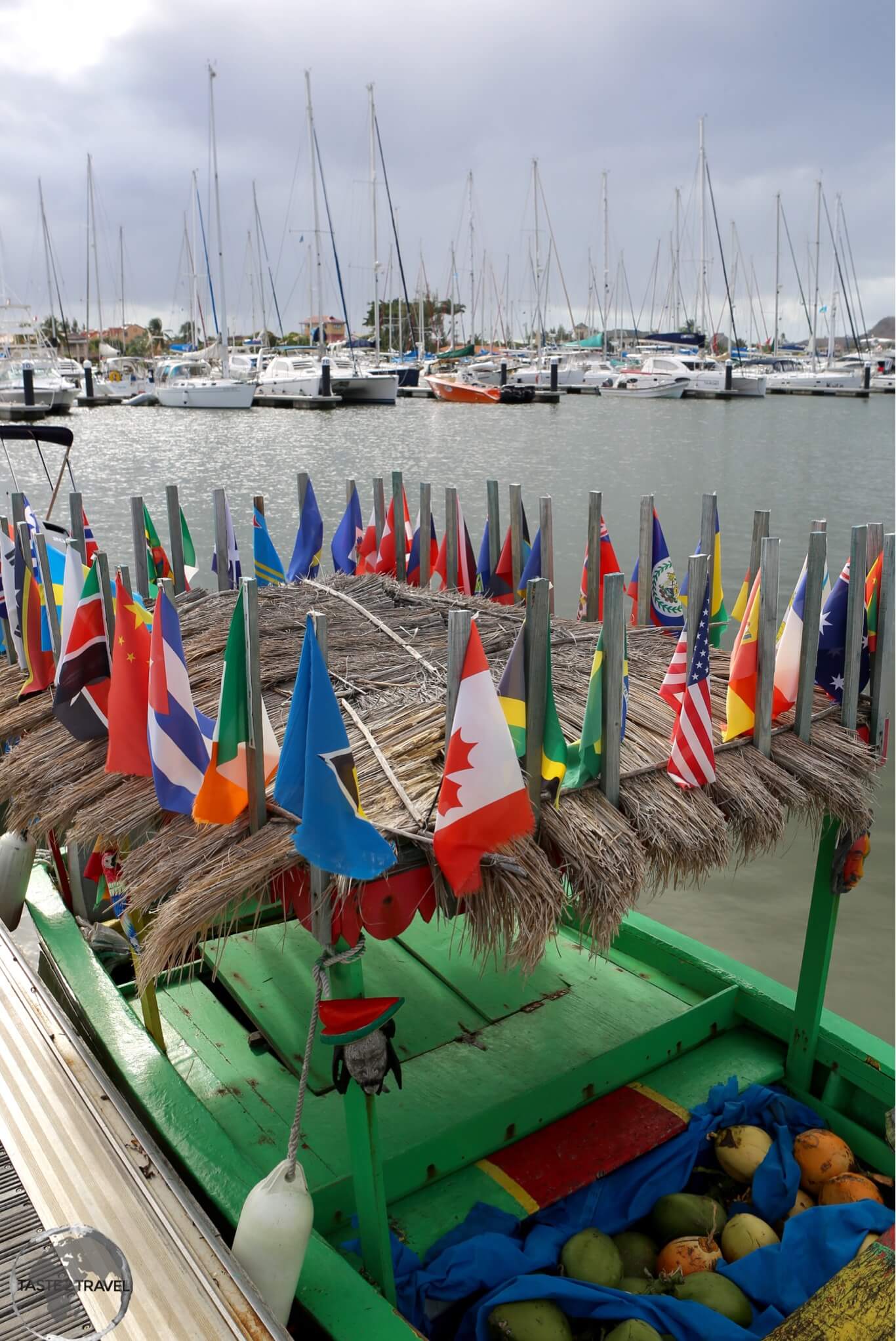 A boat at Rodney Bay marina, flying all the flags of the Caribbean and North America.