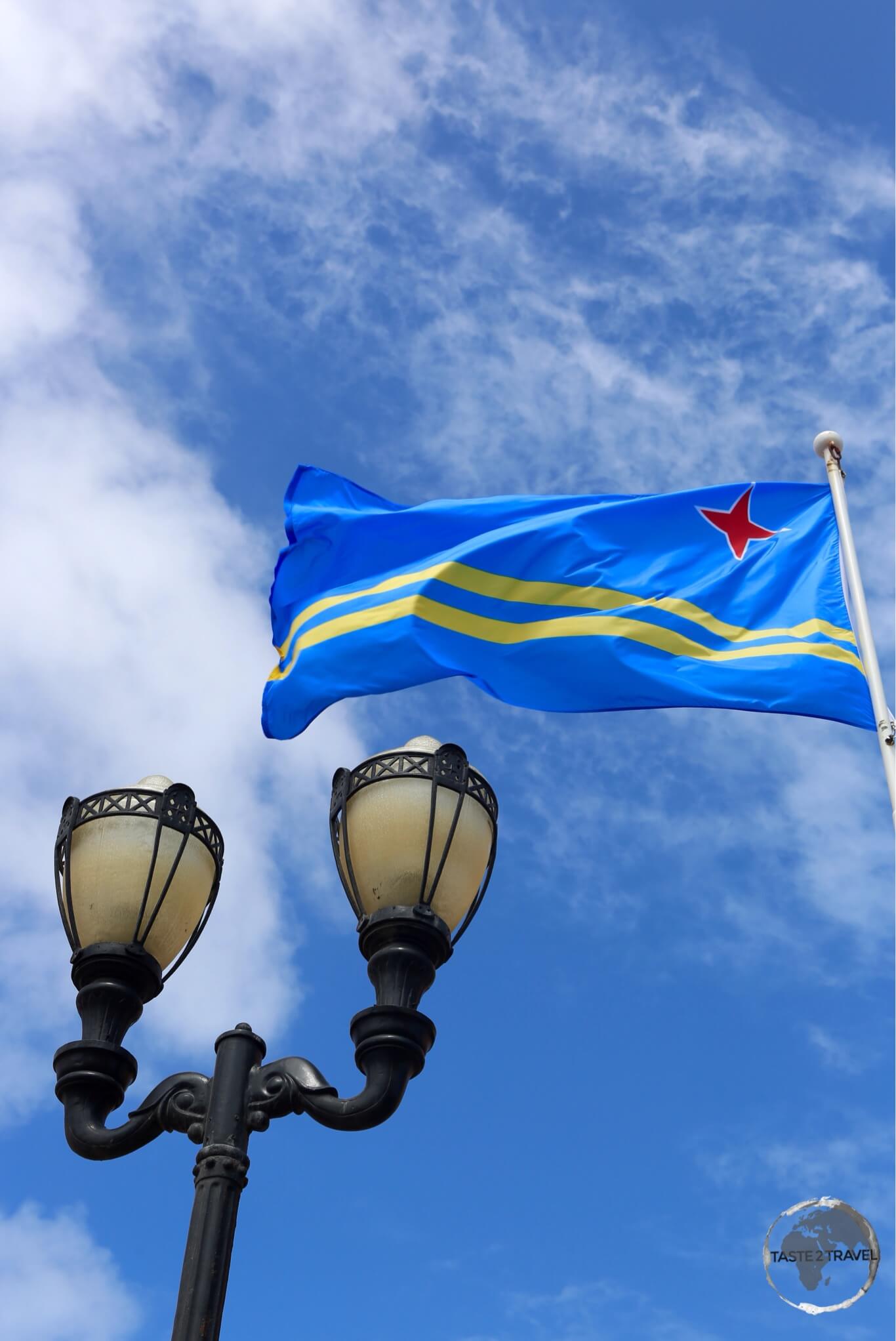 The flag of Aruba flying in downtown Oranjestad. Aruba Flag Oranjestad