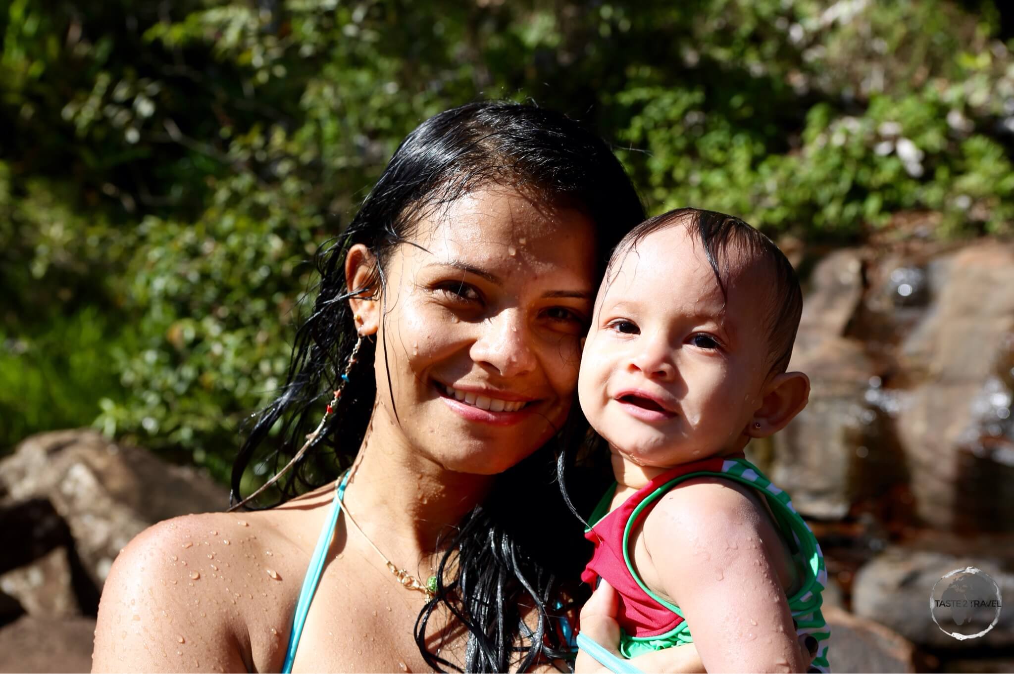 A family from Caracas enjoying a refreshing dip in one of the waterfalls at Canaima National Park.