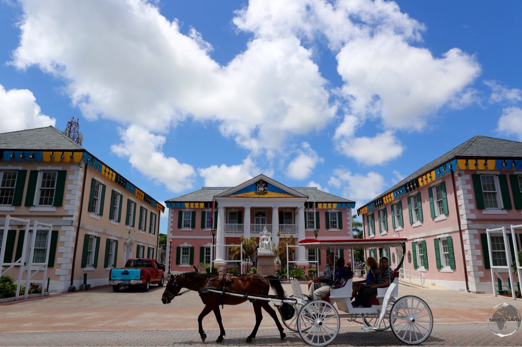 Horse and carriage pass by Parliament Square, Nassau.