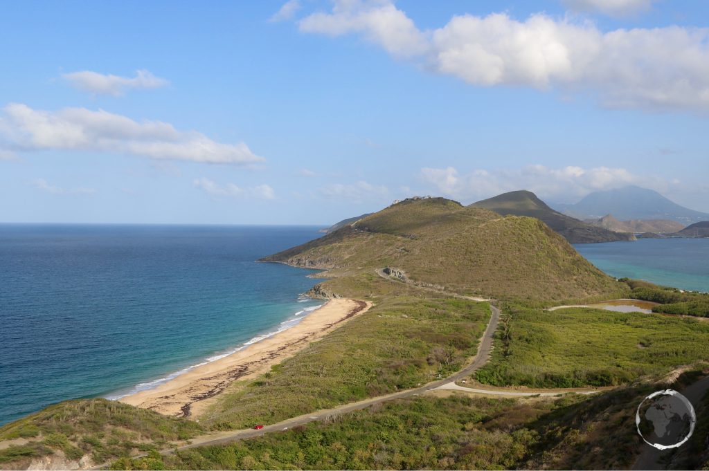 A view of the isthmus and peninsula at the southern end of St. Kitts. Nevis peak is in the distance.
