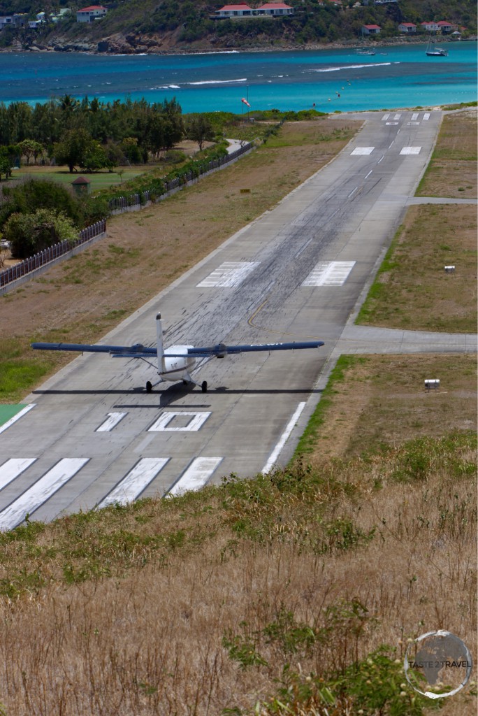 Winair flight landing at St. Barts airport, which boasts one of the shortest runways in the world at just 650 metres.