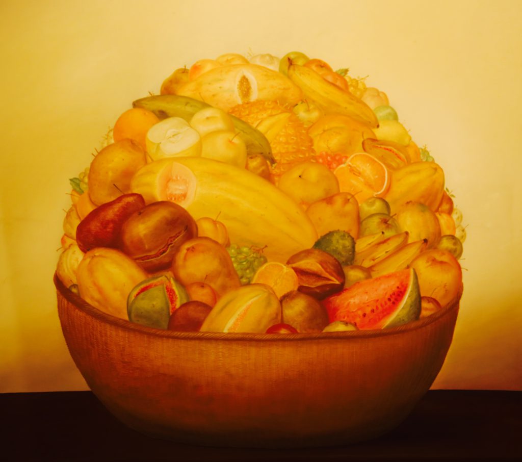 'Cesta con Frutas' (Basket with Fruits) by Fernando Botero (1973), on display at the Museo de Antioquia in Medellin, Colombia.