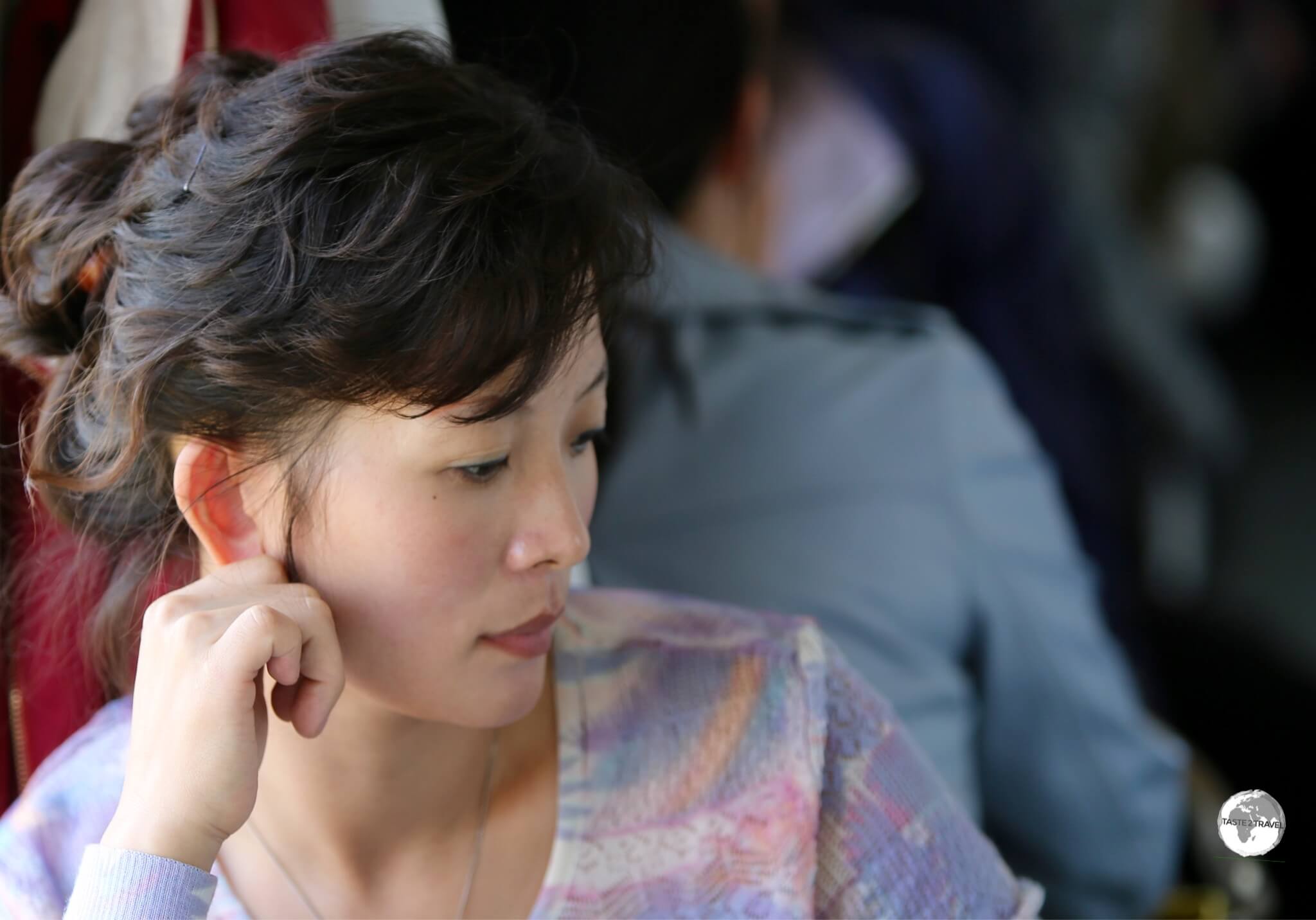 Deep in thought - a North Korean passenger on the train from Sinuiju to Pyongyang,