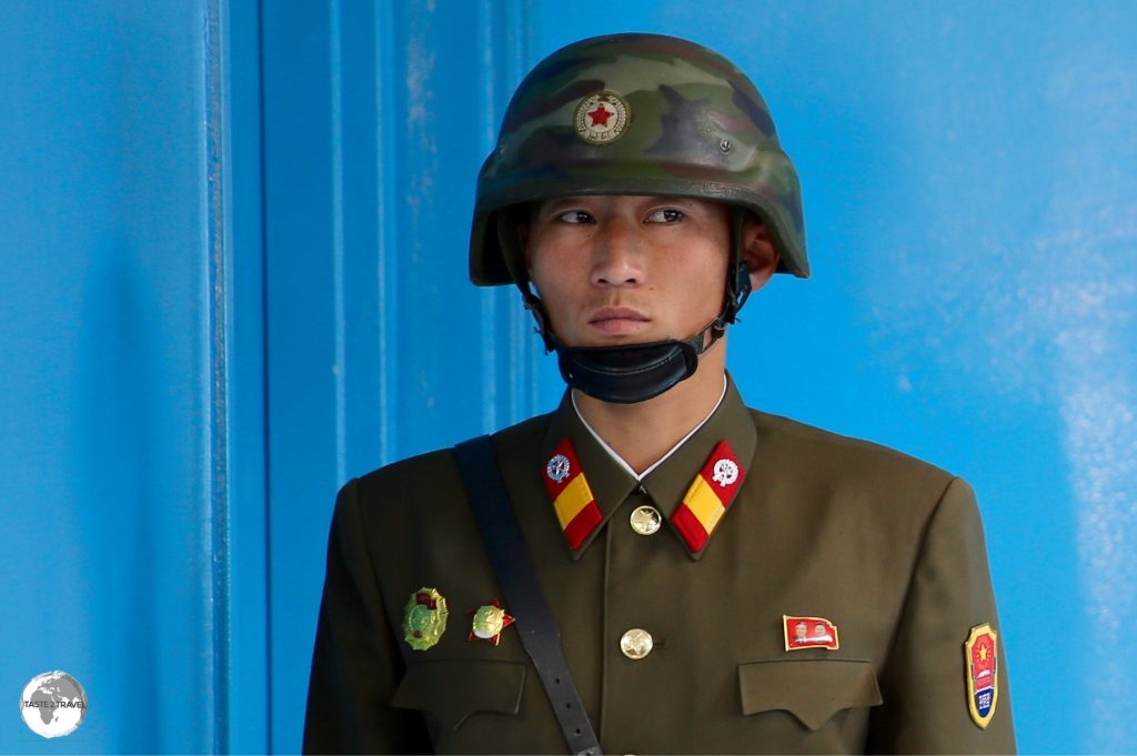 North Korean soldier at the DMZ guarding the door which opens into South Korea.