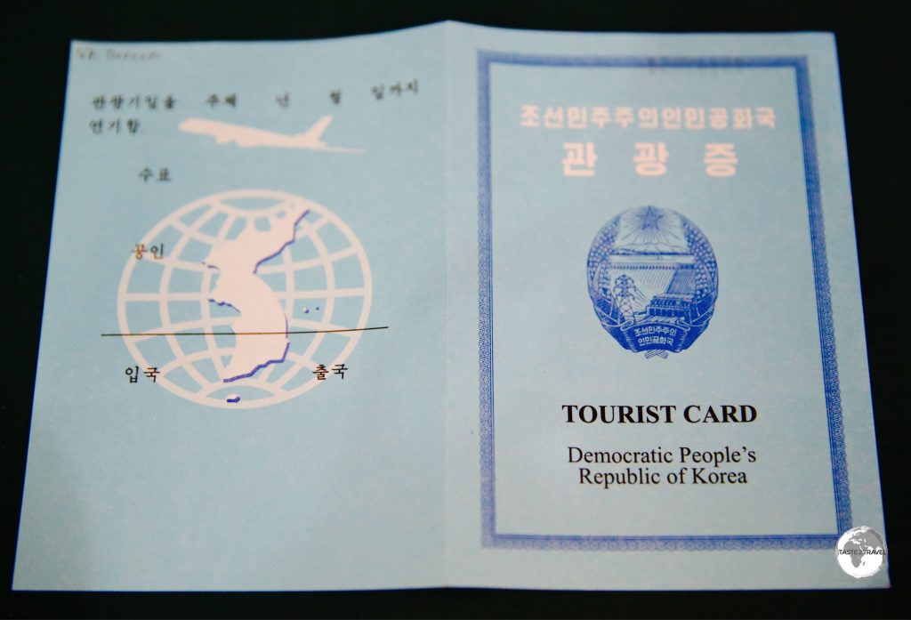 DPRK loose-leaf tourist visa. This is retained by immigration when you exit.