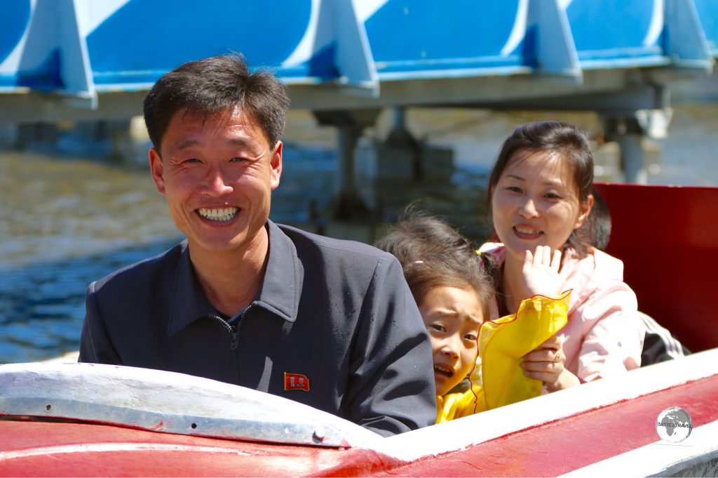 A family enjoying the splash boat ride at Mt Taesong Amusement Park in Pyongyang.
