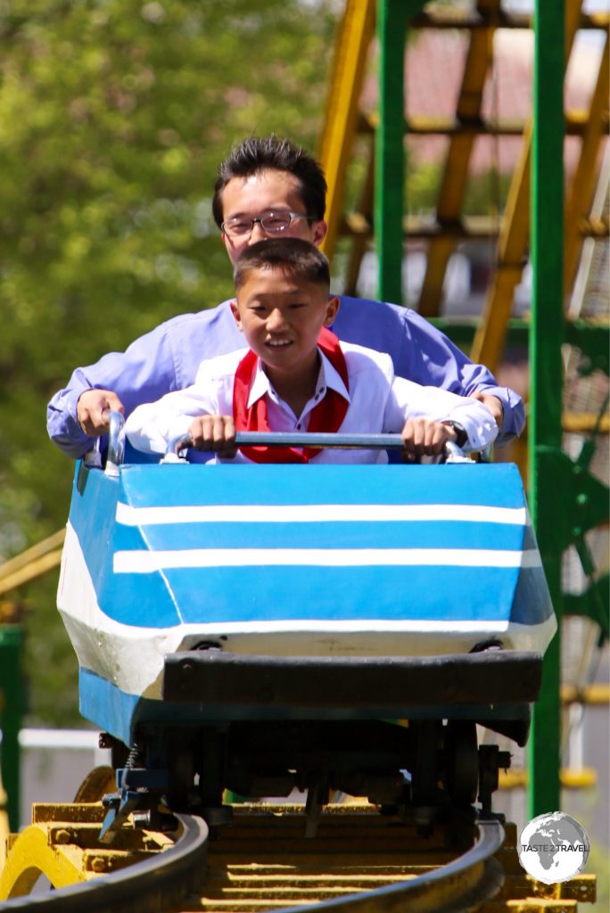 Roller coaster ride at Mt Taesong Amusement park, where all rides are free, on a busy May Day holiday.