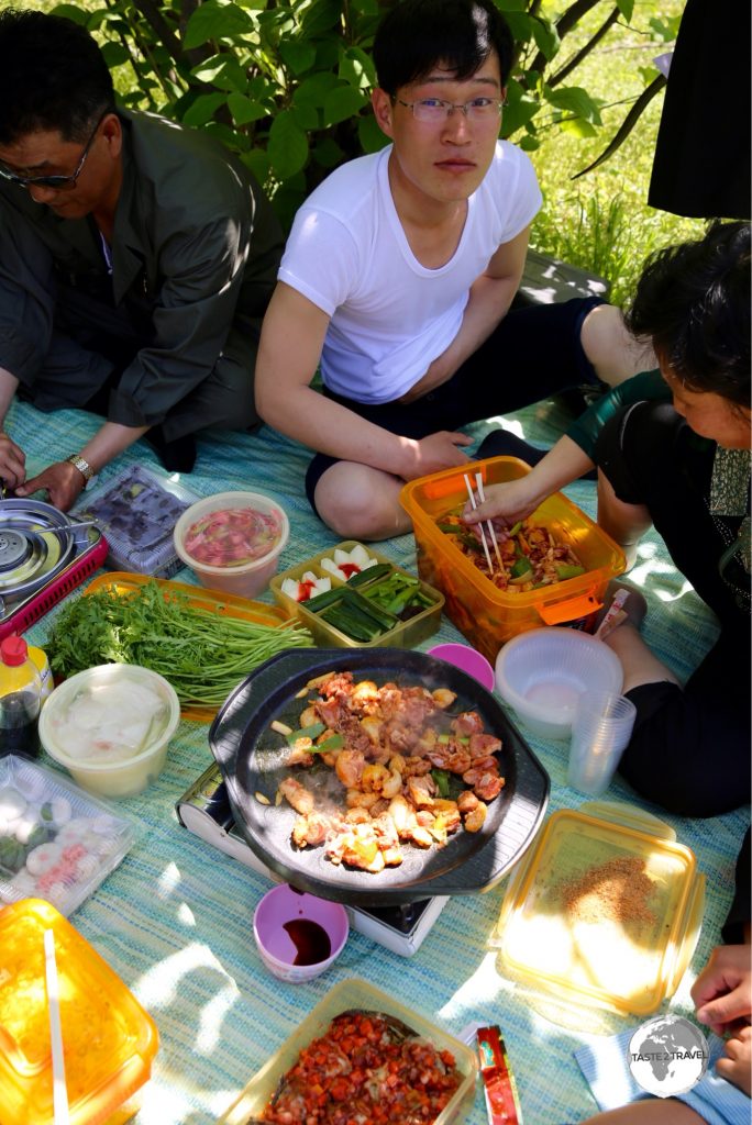 North Koreans enjoy a May Day picnic on Moran Hill. Picnics are a popular pastime in North Korea with plenty of food and Soju (rice wine) consumed.