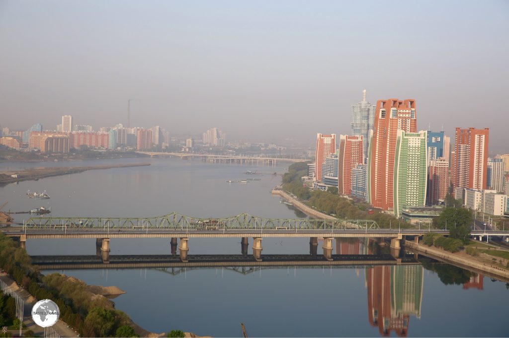 Morning view of the Taedong river and Future Scientist street from the Yanggakdo International Hotel.