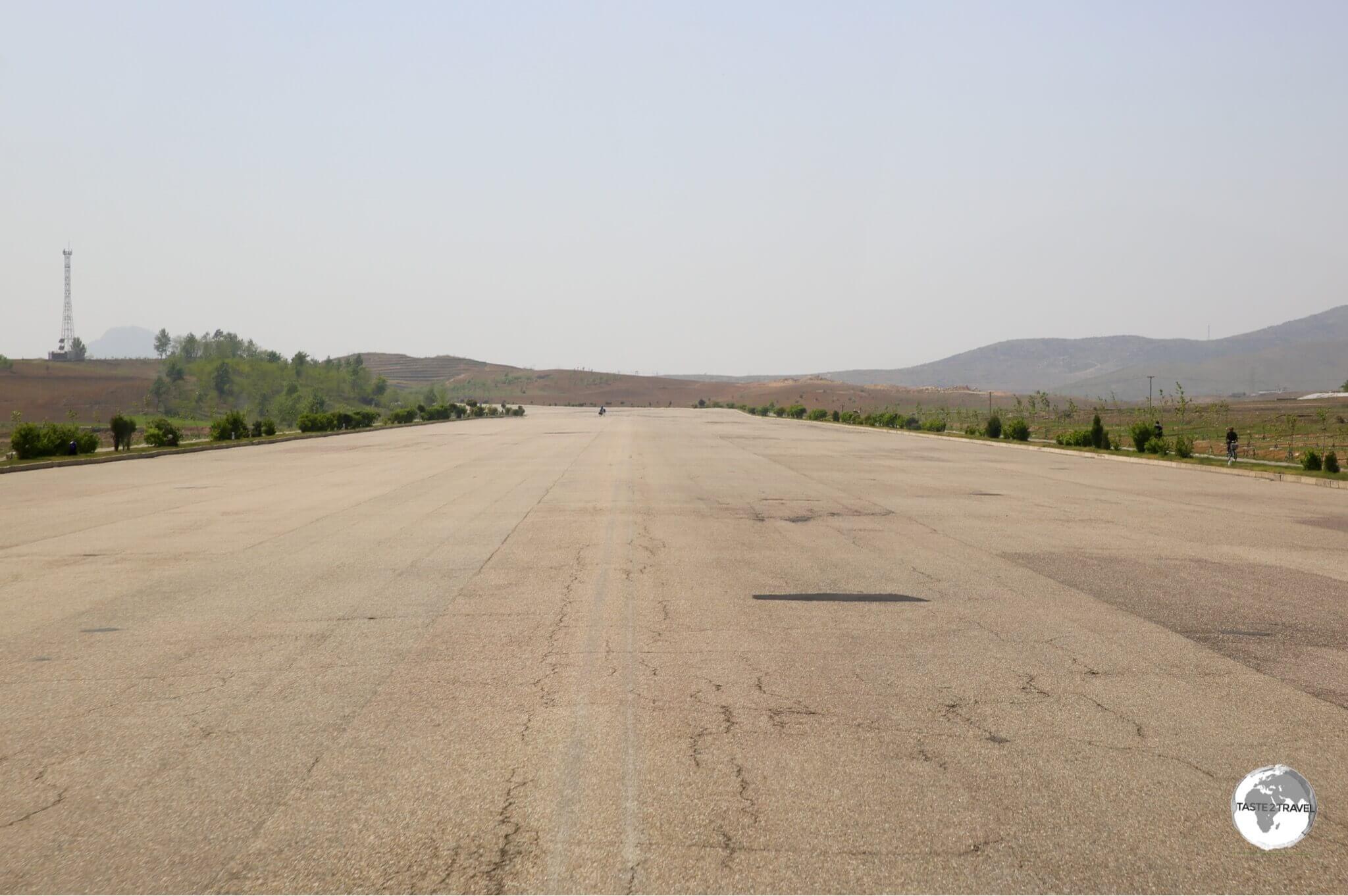 The wide, empty expressway connecting Pyongyang to Nampo is typical of roads in North Korea - completely free of traffic.