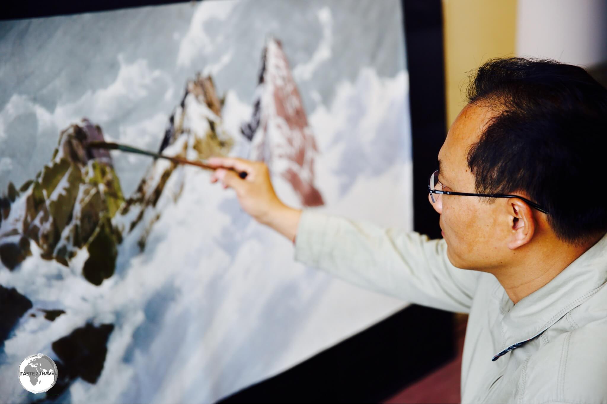 One of the resident artists at the Mansudae Art Studios in Pyongyang.