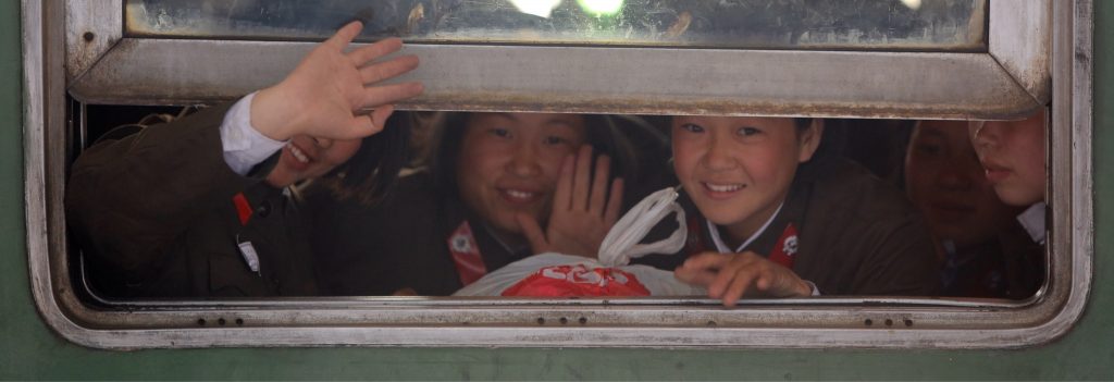North Korean students waiting to depart on a local train at Pyongyang railway station.