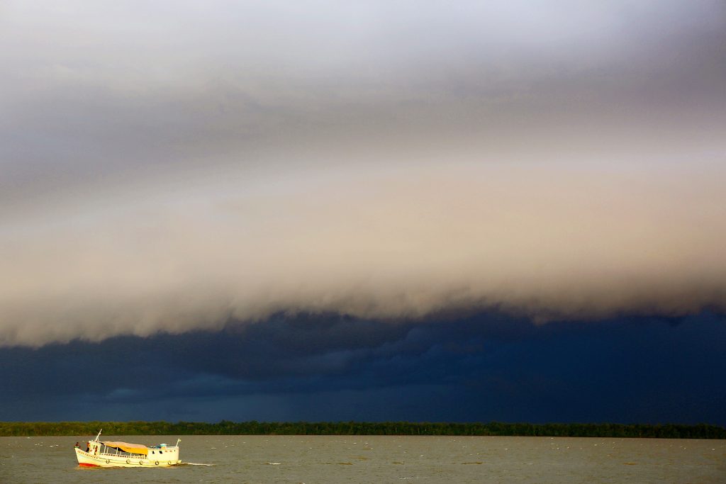 Daily storm clouds gather over the Amazon River near Belém.
