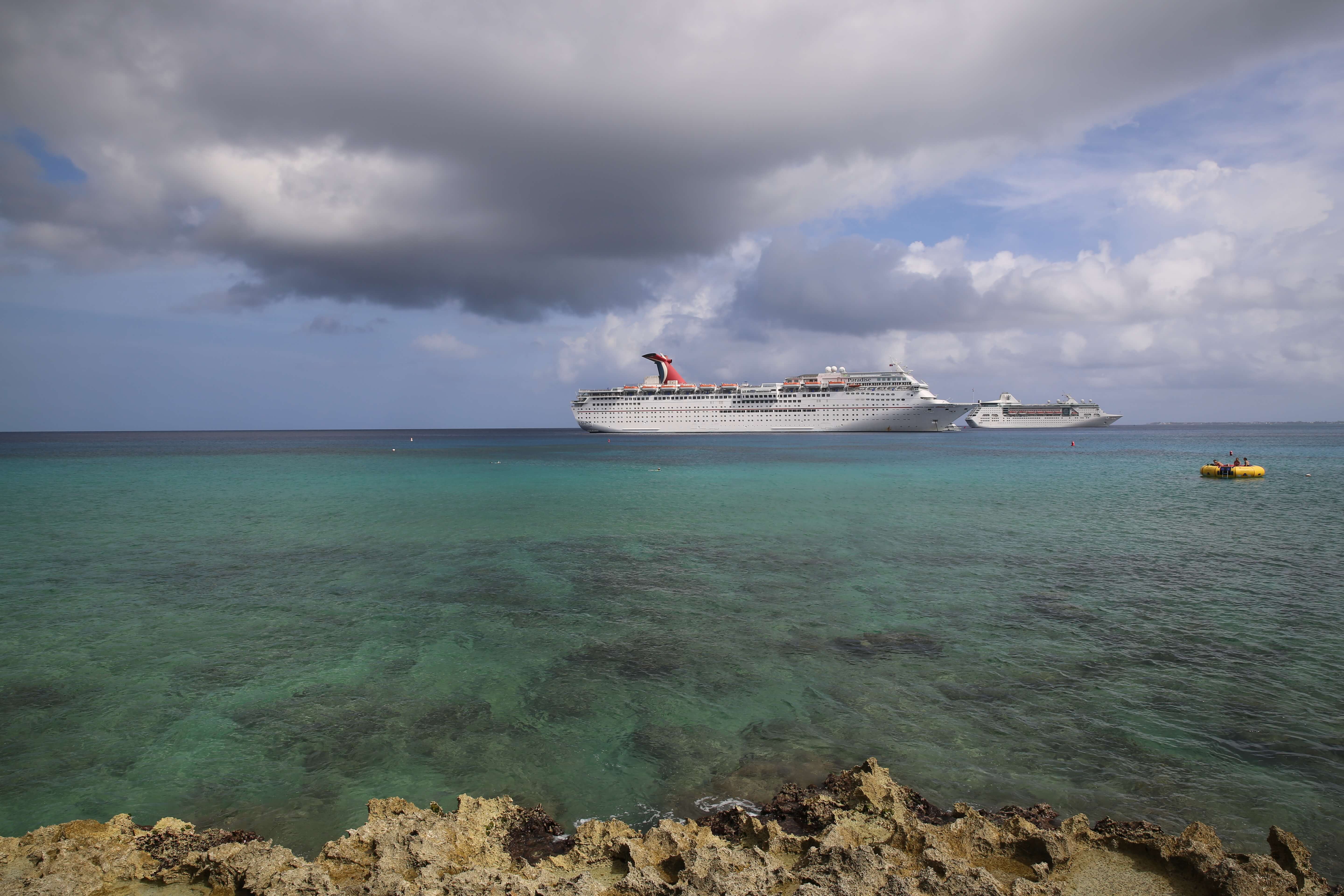 Cruise ships visiting George Town dock offshore.