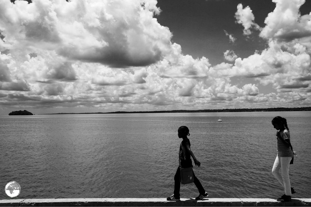 Girls walking along the Essequibo riverbank in Bartika, Guyana.