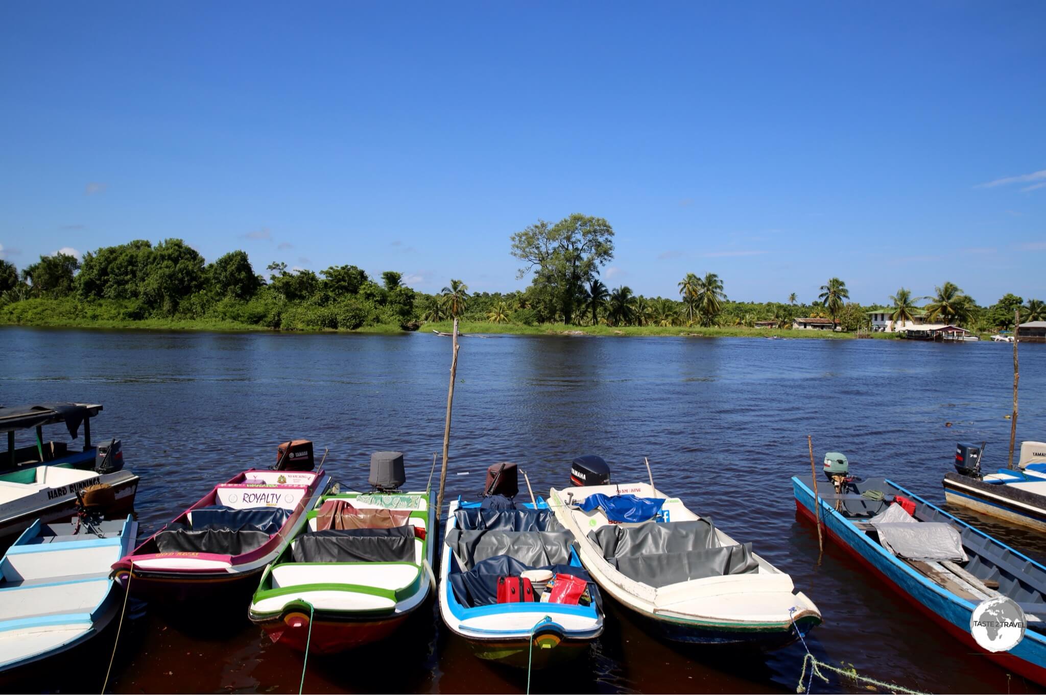 Passenger speedboats on the Pomeroon River in the riverside town of Charity.