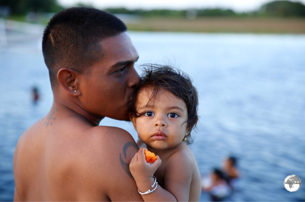 Father and daughter swimming at Lake Capoey.