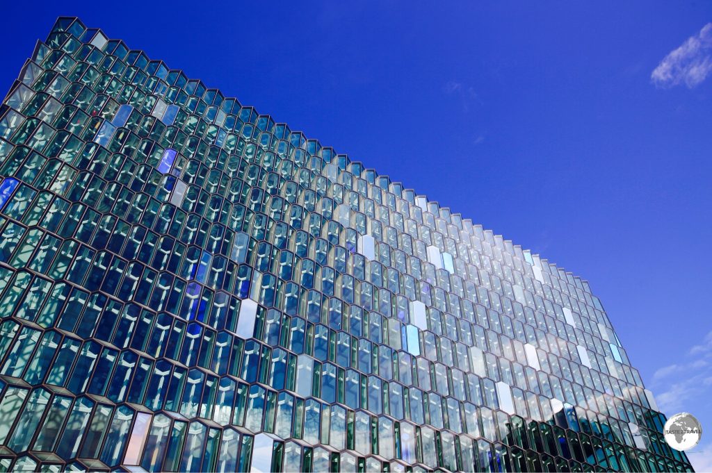 The distinctive coloured glass facade of the Harpa concert hall is inspired by the basalt landscape of Iceland.