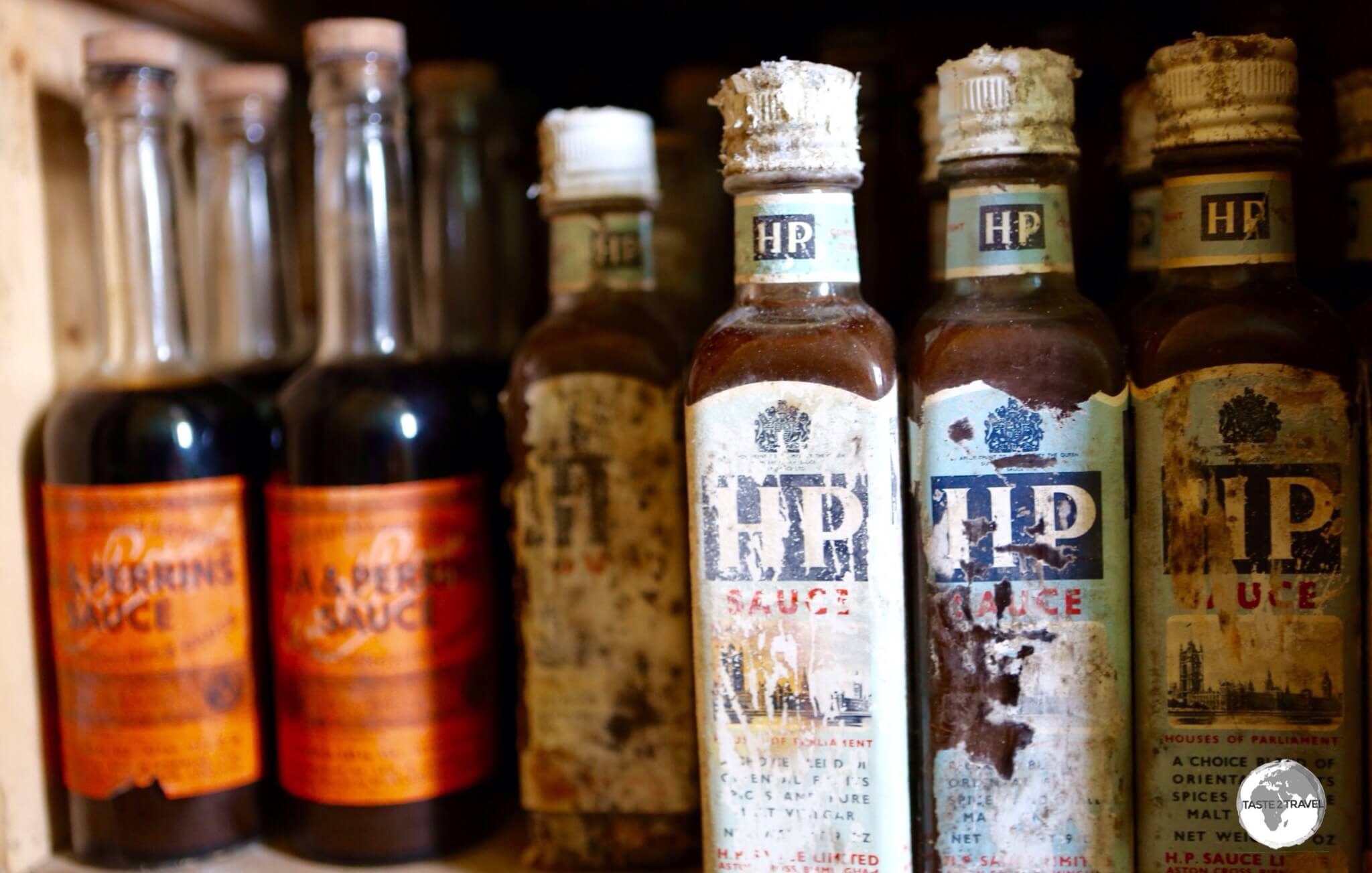 Unopened bottles of sauce remain in the kitchen cupboards at <i>Base W</i> on Detaille Island.