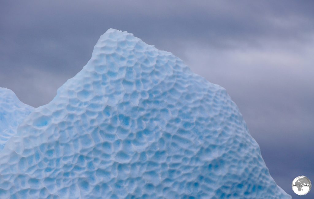 The dimpled, exposed underside of a turned iceberg in Crystal Sound.