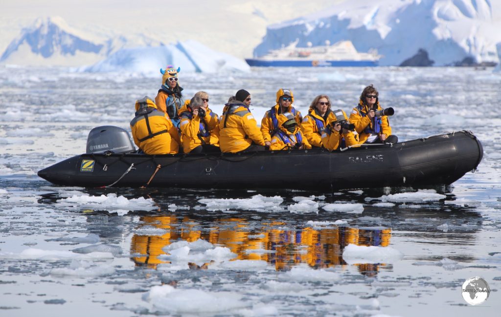 An early morning Zodiac sea excursion in the Graham passage, Antarctica.