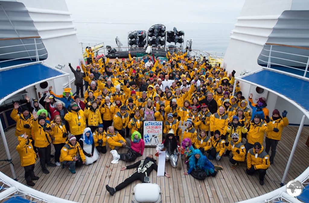 A group photo at the stern of the Ocean Diamond after crossing the Antarctic Circle.