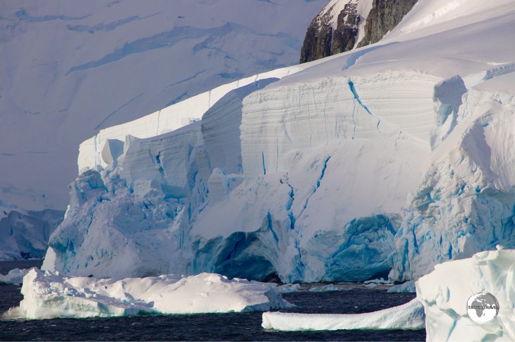 The narrow Lemaire channel is lined with gigantic glaciers and vertical granite peaks and ridges.