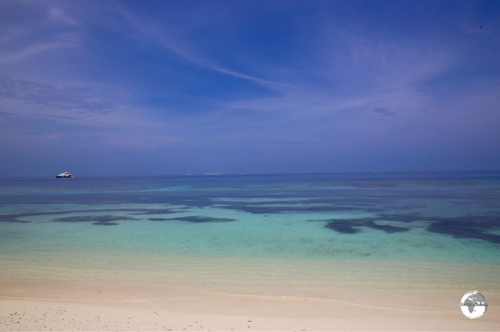 The low-lying islands of the Maldives feature white coral sandy beaches and are surrounded by fringing reefs.
