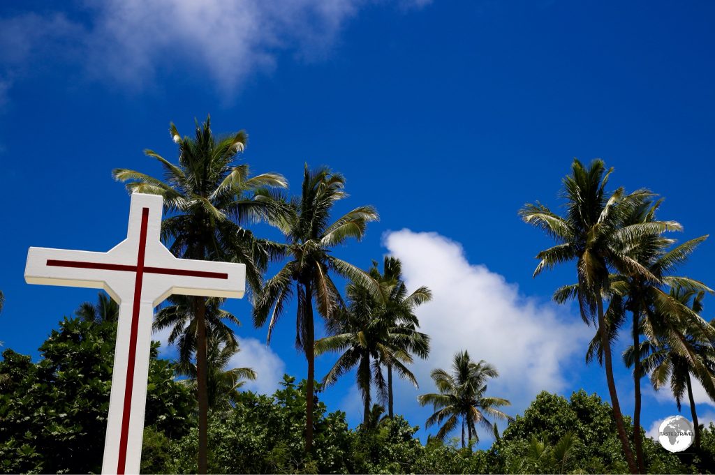 A cross among the palm trees on Pangaimotu island.