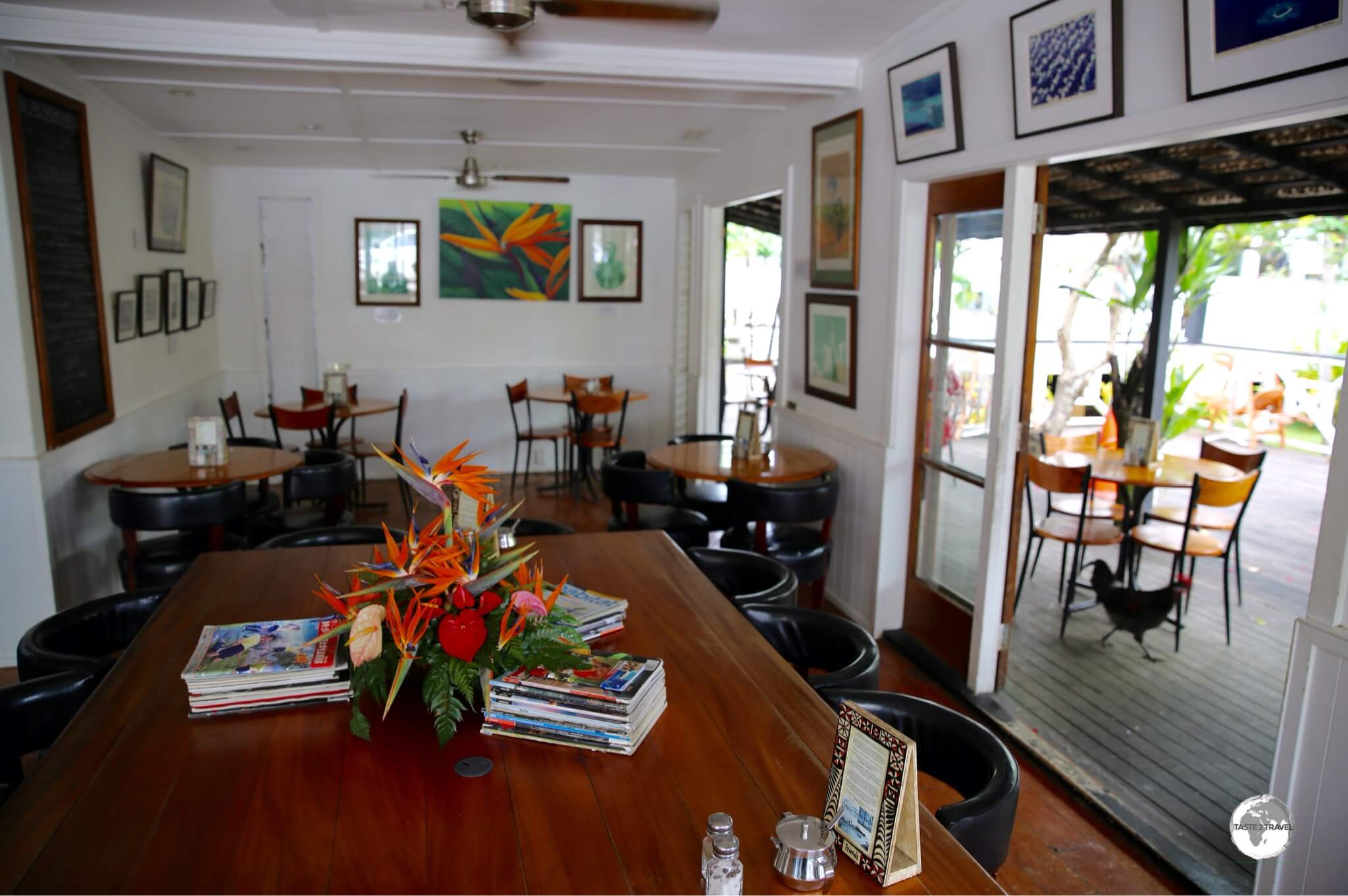 My favourite café in Tonga, Friend's Café, where roaming roosters clean up stray crumbs.