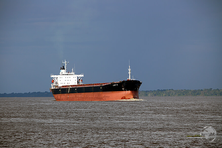 A long way from the Atlantic ocean - 1,400 km upriver on the Amazon river, an ocean-going freighter approaches Manaus port.