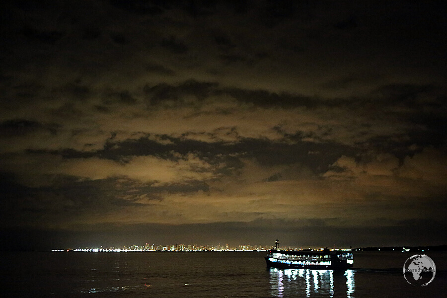 The glow of bustling Belém lights up the sky as I approach on my slow boat from Santerem - the end of a 48 hour journey.