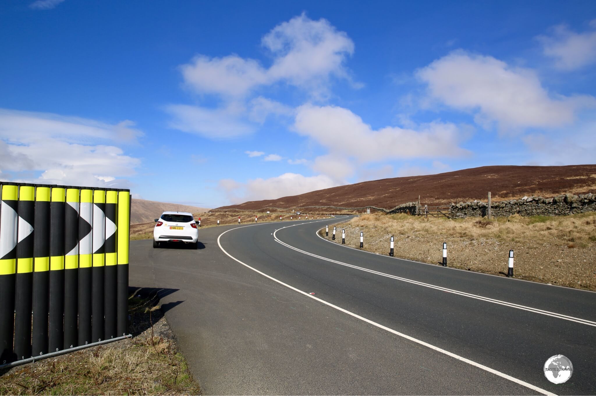 Taking a pit stop while driving my rental car around the TT circuit.