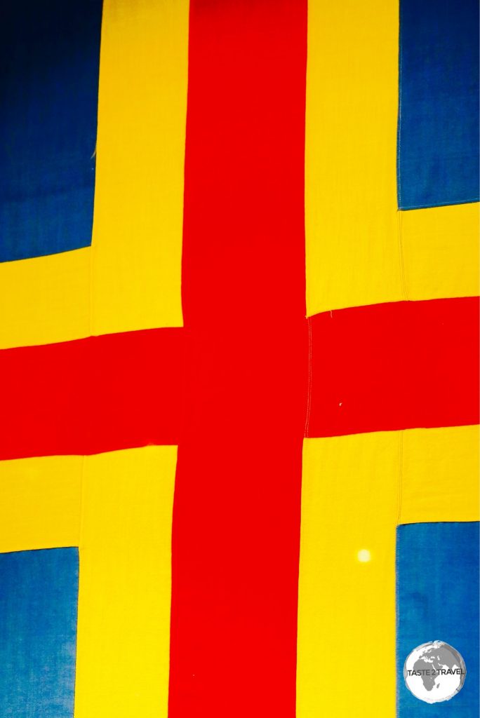 The flag of the Aland Islands is a Swedish flag over-layed with a red cross.