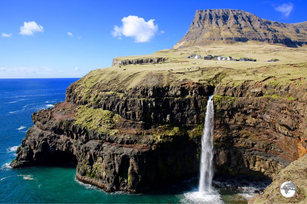 Mulafossur Waterfall plunges 60 metres into the Atlantic Ocean.