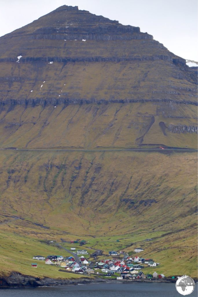 The highest mountain in the Faroe Islands - Slættaratindur - towers over the village of Funningur.