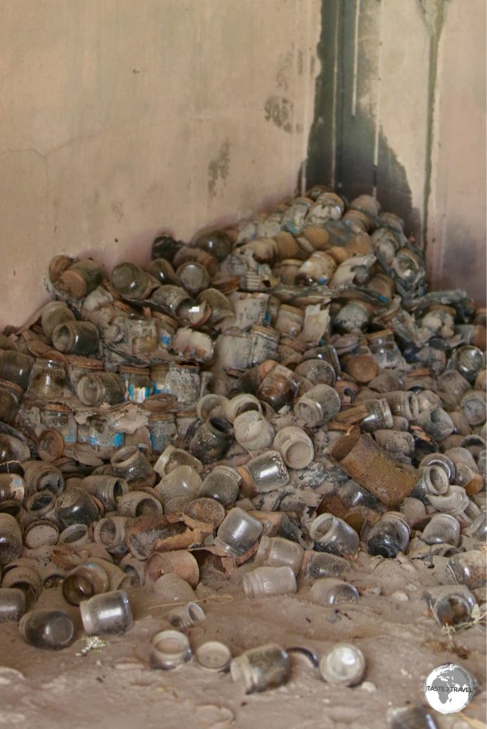 Baby food bottles litter the ash-covered floor of Angelo's supermarket.