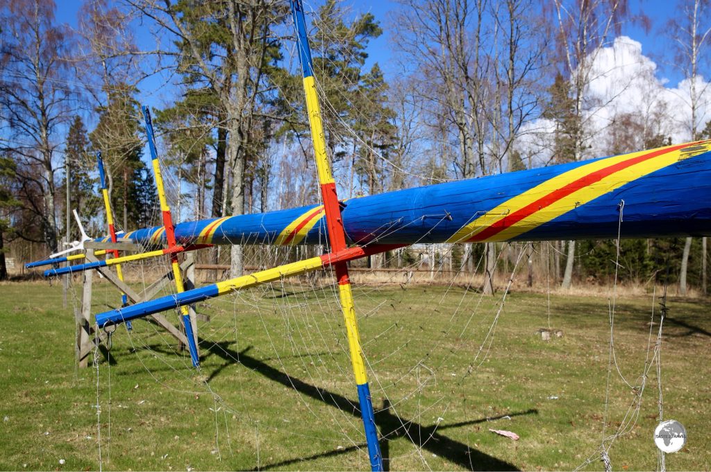 A Maypole painted in the Aland colours being prepared for the upcoming mid-summer festivities.