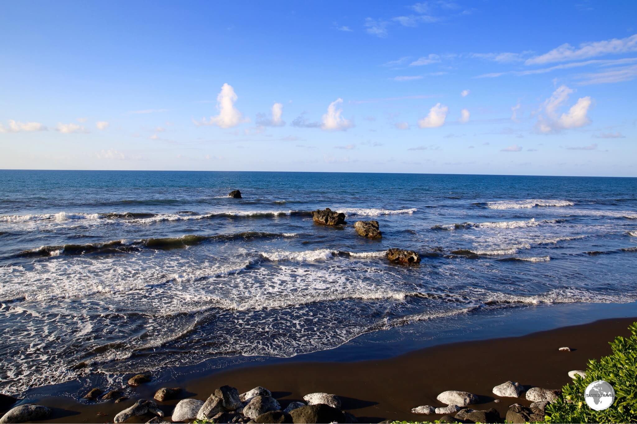A black-sand beach on the east coast of Tahiti.