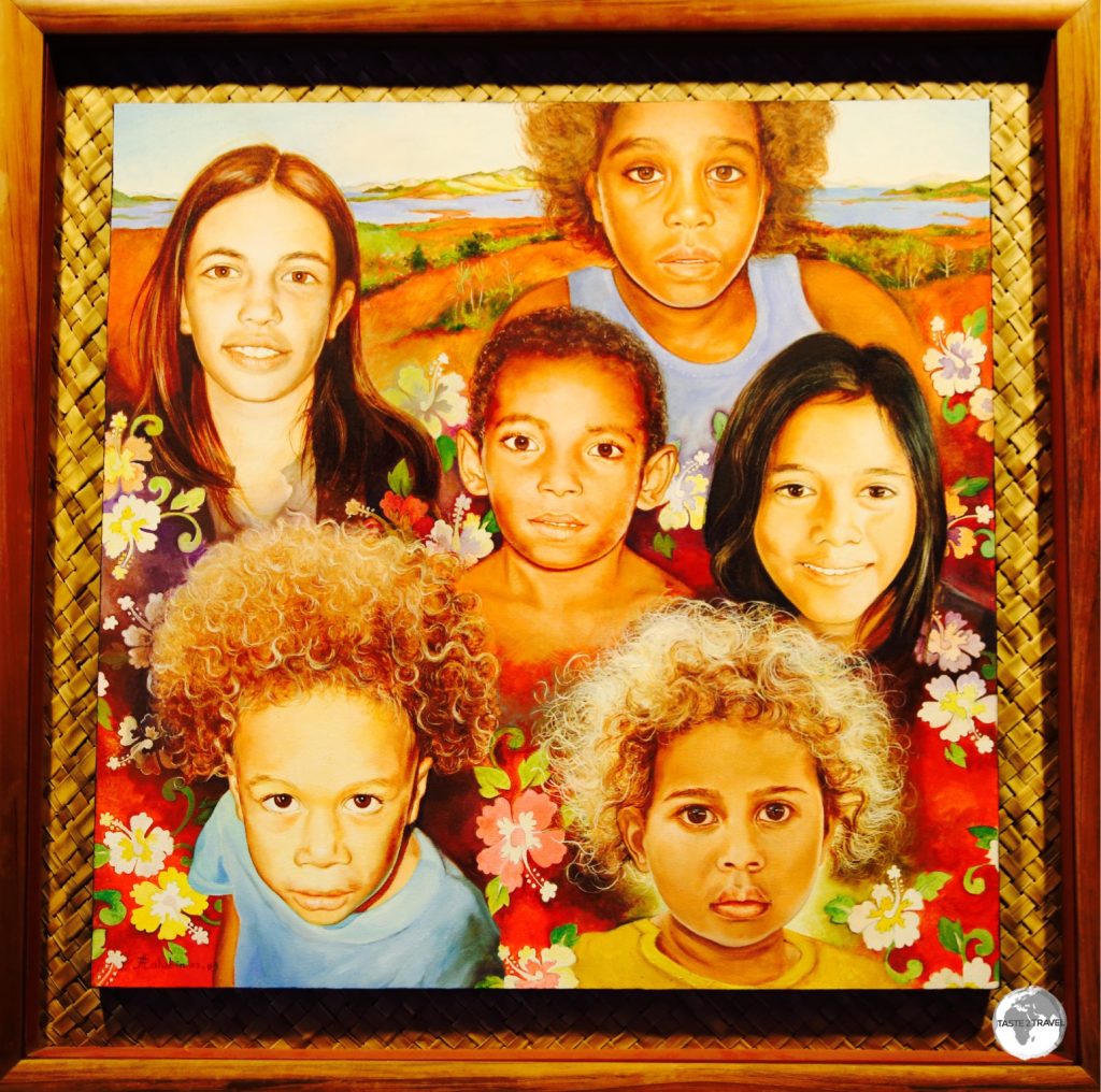 Artwork depicting the faces of New Caledonia at the Museum of New Caledonia.