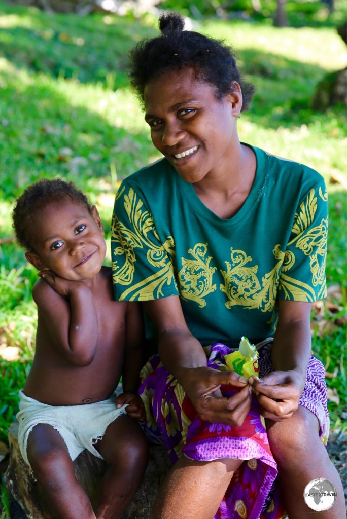 Mother and daughter relaxing on the beach on Tanna.