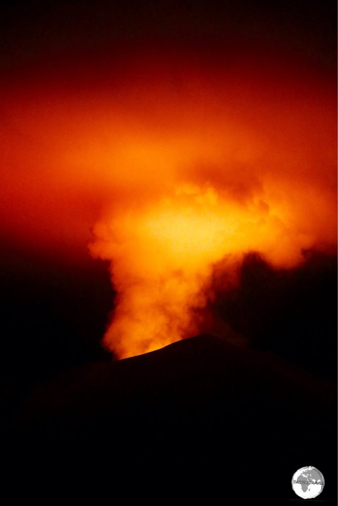 The night-time glow from the Mount Yasur volcano illuminates the night sky.