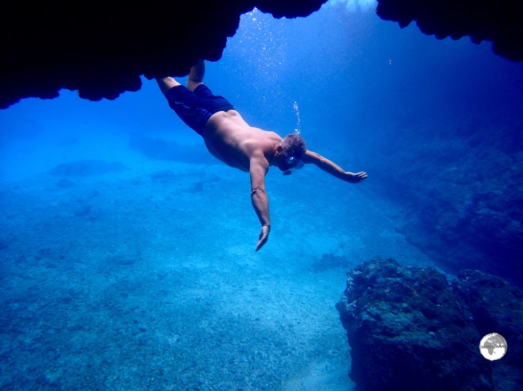 Yours truly making a graceful entry into the Blue Cave on Tanna.