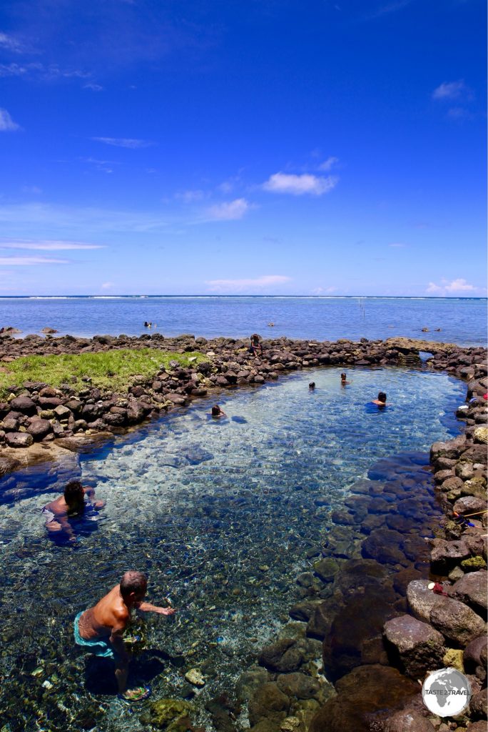 The beautiful Vaiole Tama Spring is fed by a source hidden inside a coastal cave.