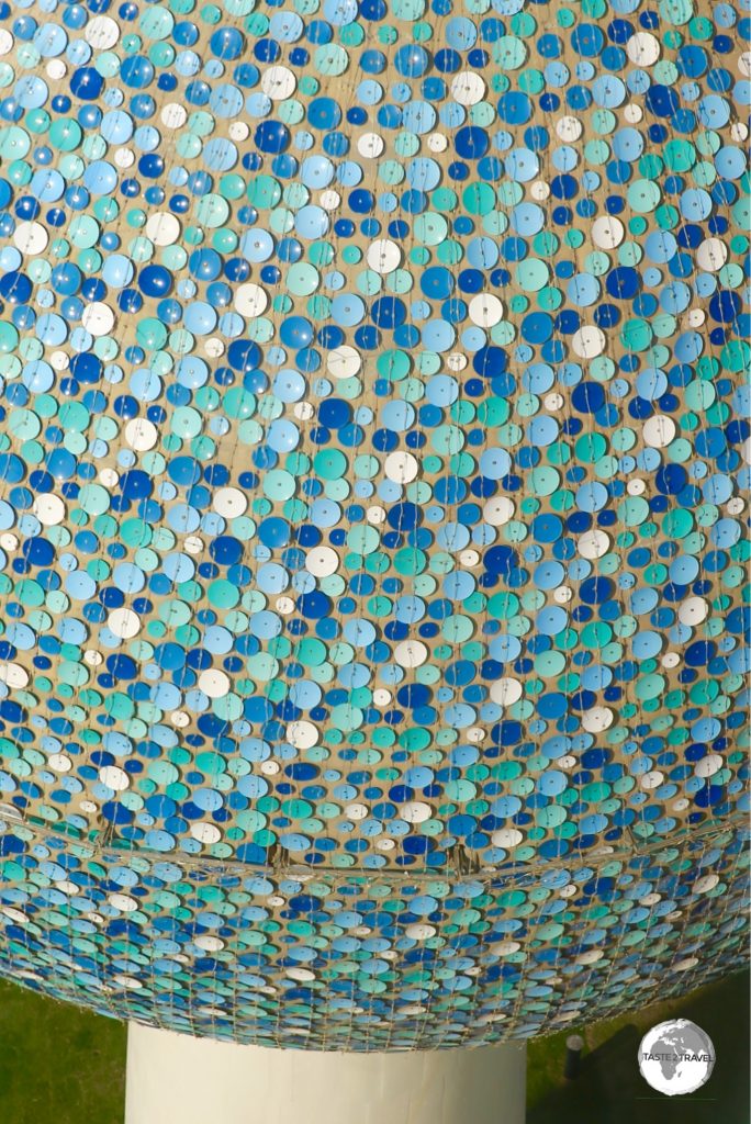 The three spheres of the water towers are covered by approximately 41,000 enamelled steel discs.