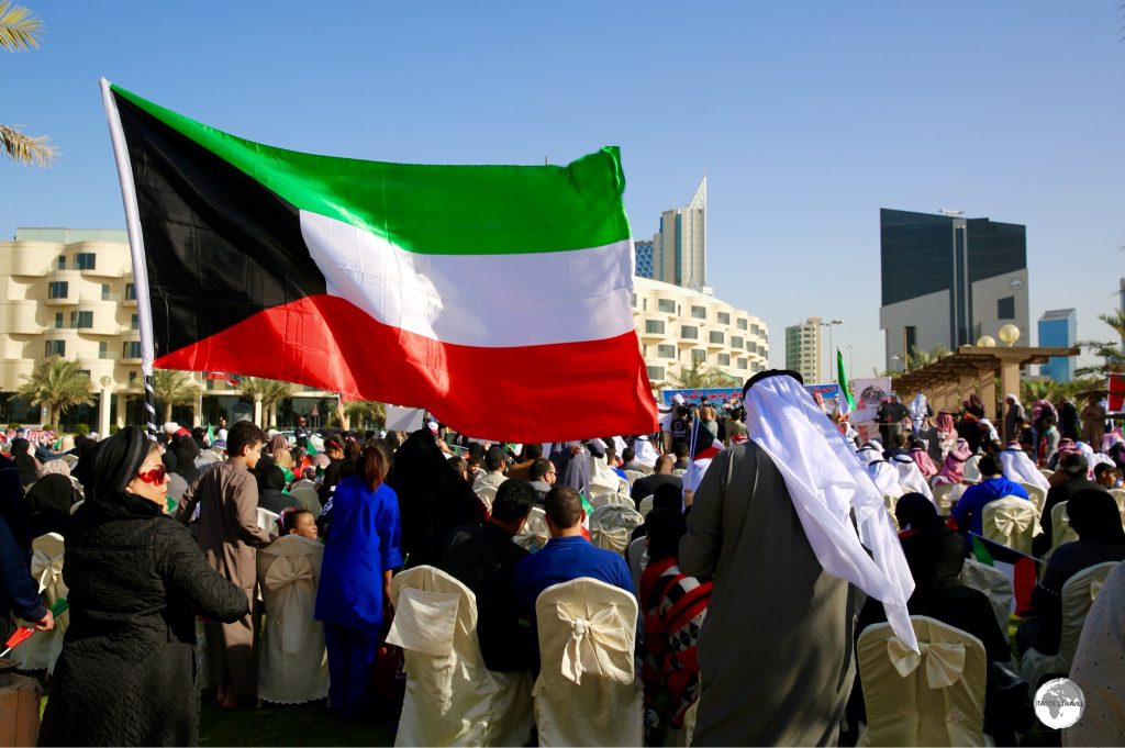 The Kuwaiti flag is flown everywhere throughout the country, including at this political rally in Kuwait city.