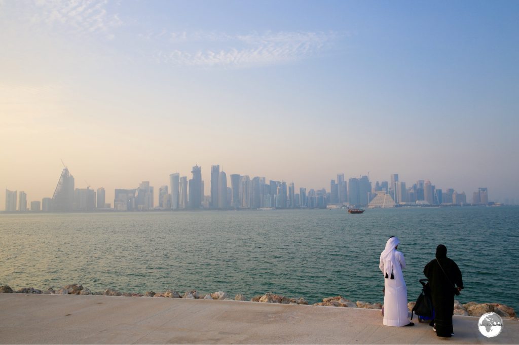 A Qatari couple admiring the Doha skyline from MIA park.
