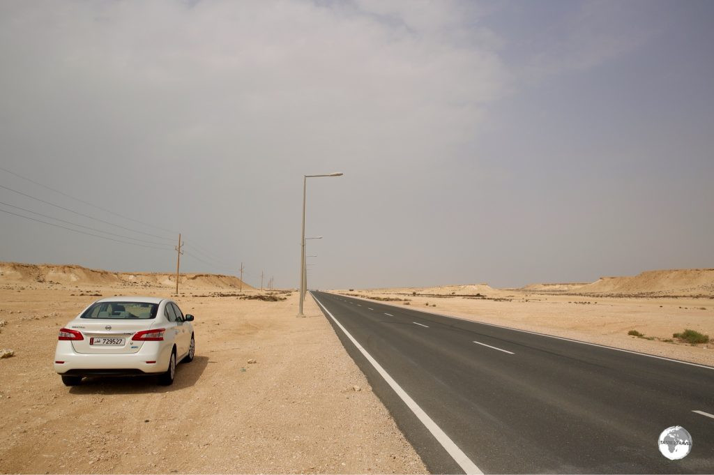 On the road to Zekreet in my rental car.