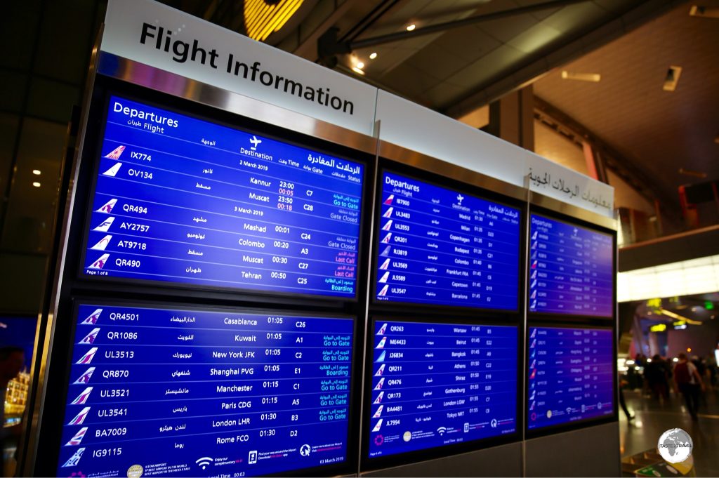 Departures board at Hamid International Airport.